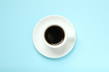 Cup of coffee on color background