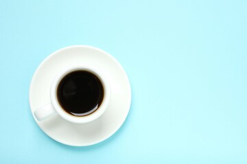 Cup of coffee on color background