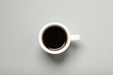Cup of coffee on gray background
