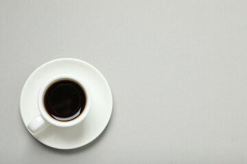 Cup of coffee on gray background