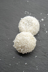 Japanese dessert mochi with red bean filling and coconut flakes. chopsticks.  food concept.