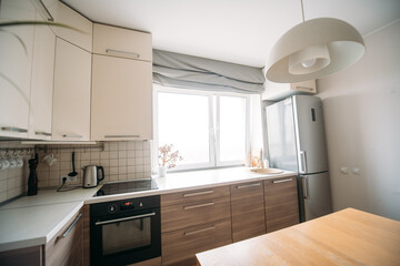 A spacious kitchen-living room in the apartment. No one, no people.