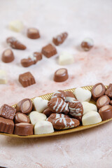 Handmade chocolate with pistachios, dark and milk chocolate pieces.