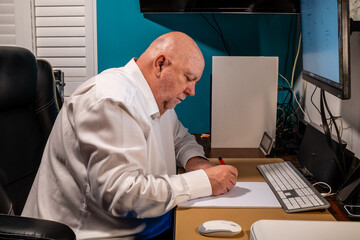 Elderly man starting to learn photography and get out more to get some exercise due to being overweight as a result of a sedentary job.