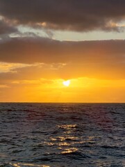 Moody sunset over the sea with clouds