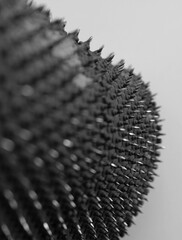 Selective Focus Closeup Image Of Rubber Material Punctured by Small Nails 
