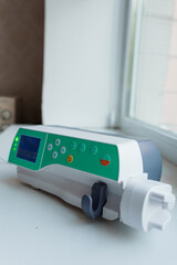 Medical Infusion Pump on a Windowsill