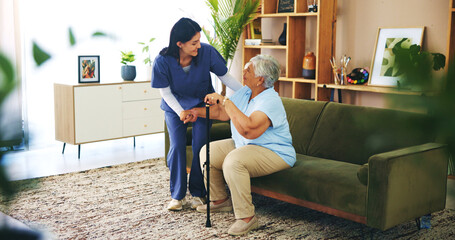 Nurse, senior woman and help with walking stick in lounge for mobility, strength or assisted...