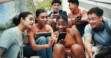 Students, people and tech on stairs at university, wow and share meme with diversity in low angle at campus. Group, friends and happy on steps with phone, tablet or streaming comic video at college