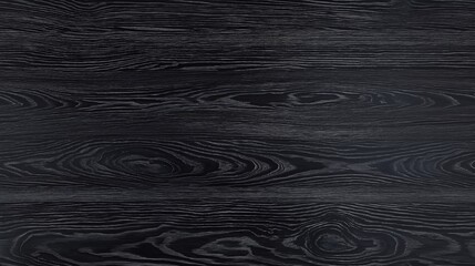 Textured black wood surface, showcasing intricate grain patterns and a smooth finish.