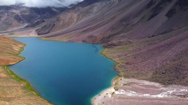 Aerial view of chandratal lake surrounded by snow-capped Himalayan mountains at chandratal in lahaul and spiti valley himachal pradesh, India.