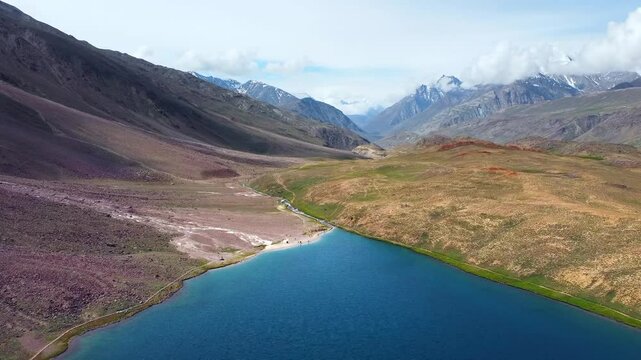 Aerial view of chandratal lake surrounded by snow-capped Himalayan mountains at chandratal in lahaul and spiti valley himachal pradesh, India.