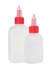 Bottles of glue with caps isolated on white