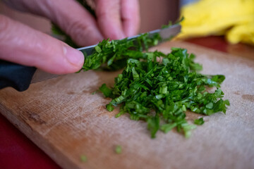 person cutting parsley