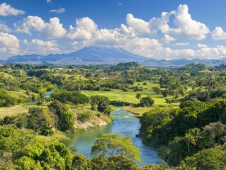 Scenic landscape featuring a river, lush greenery, and mountains under a blue sky.