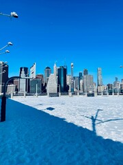 New York Skyline view, with Snow in Front of it, clear blue sky