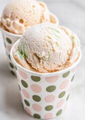 Delicious scoops of ice cream in a patterned cup