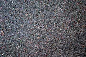 Wet asphalt texture in autumn