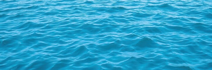Obraz premium Blue water wave texture background with soothing ripples and gentle movement, design, peaceful