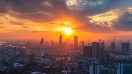 Obraz premium Sunset over Bangkok cityscape. Concept of urban life, vibrant city, and golden hour.