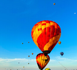 Hot Air Balloons Rising at Sunrise with Vibrant Colors