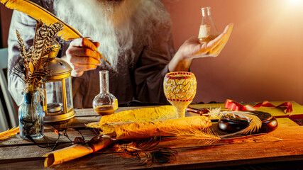 hand an ancient alchemist scientist conducts experiments