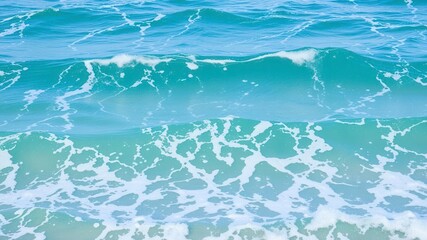 Naklejka premium Blue turquoise ocean water with frothy waves and foam texture, waves, natural, ocean