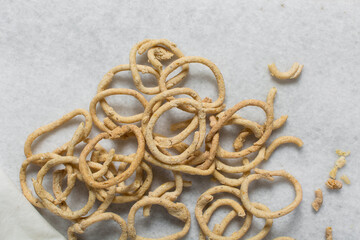 Top view of fried corn rings snack on a white tray, Overhead view of nigerian kokoro egba corn...