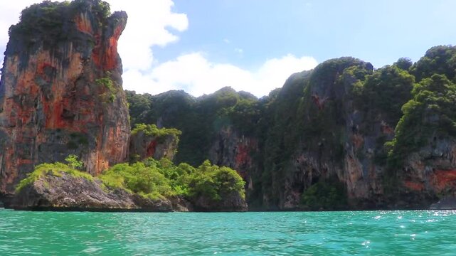 Go by boat trip limestone cliffs and turquoise waters Thailand.