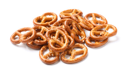 Many delicious pretzel crackers isolated on white