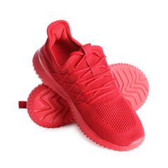 Pair of stylish red sneakers isolated on white