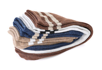 Many folded soft socks isolated on white