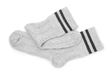 Pair of soft socks isolated on white, top view