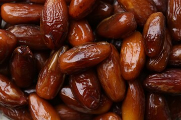 Tasty sweet dried dates as background, closeup
