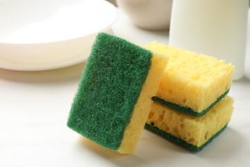 Many soft sponges on white table, closeup