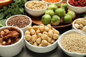 Superfood. Different healthy food products on grey table, closeup
