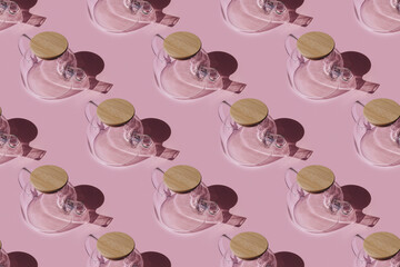 Glass teapot patterns on a pink background. Seamless pattern.