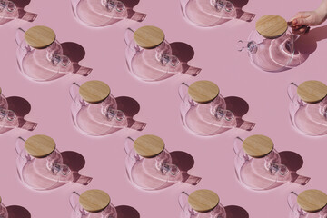 Teapots patter on pink background. Seamless pattern.