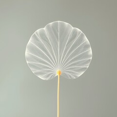 Whispers of Nature A translucent leaf dances gracefully on a neutral canvas, its delicate veins telling tales of fragility and beauty.