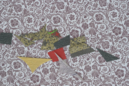 paper cutoffs on decorative scrapbooking paper with floral pattern