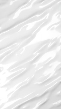Animated waves on a white surface in a seamless looped 3d video. Shiny white surface deformed with a generated waves or noise.