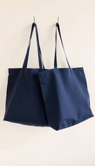 Serene Storage A Pair of Vibrant Blue Tote Bags Gracefully Displayed on Simple Hooks