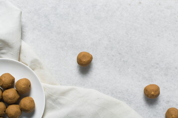 Top view of donkwa on a white background, Overhead view of nigerian spicy donkwa, flatlay of tanfiri or groundnut cake on a white countertop