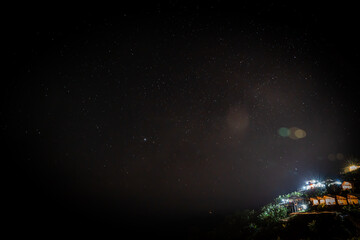 couple tourist come to hill tribe village guest house to watch stars and sky at night , cloud ,...