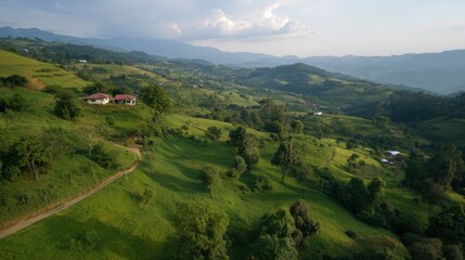 Fototapeta premium Scenic view of rolling green hills and countryside homes in serene landscape