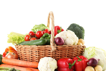 Different ripe vegetables in basket isolated on white