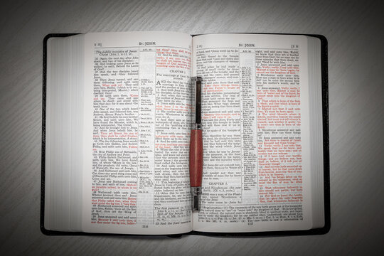 Open King James Version Bible with Wooden Pen