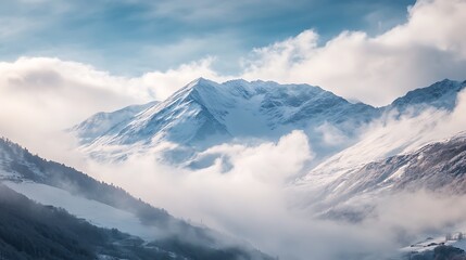 Majestic Snowy Mountain Peaks Emerging from Clouds. Inspiring Mountain Scenery.
