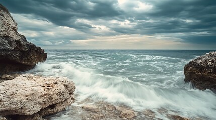 Stormy Seascape with Dramatic Clouds. Powerful Waves Crashing on Rocky Coastline.