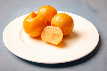 pickled lemon in a white plate